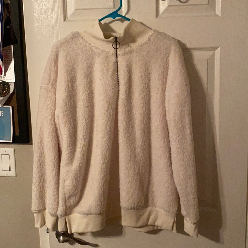 White Half-Zip pullover.